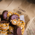 Fan-freaking-tastic! Desserts at the bar! Chocolate-dipped, cookie dough-stuffed pretzels by Let Them Eat Cupcakes, now housed in Bethel Street Tap Room. © 2014 Sugar + Shake